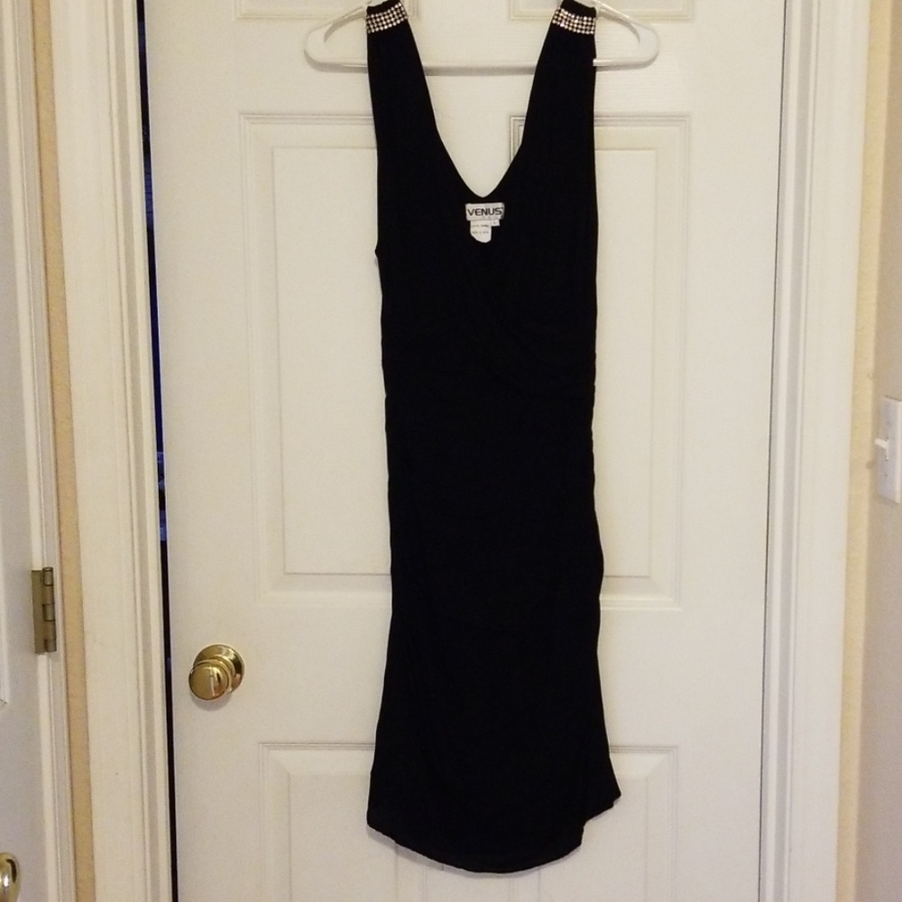 Black dress with rhinestone detail in shoulders.